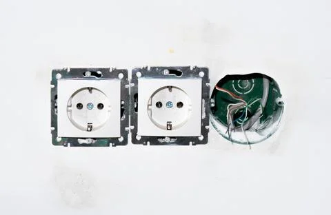 Socket faceplate without frame. two ready-made sockets and one hole for Stock Photos
