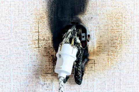Socket on fire. he is real. there is plastic melting Stock Photos