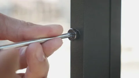 Socket head screw screwing with hex key 4K video Vídeo Stock 154079638