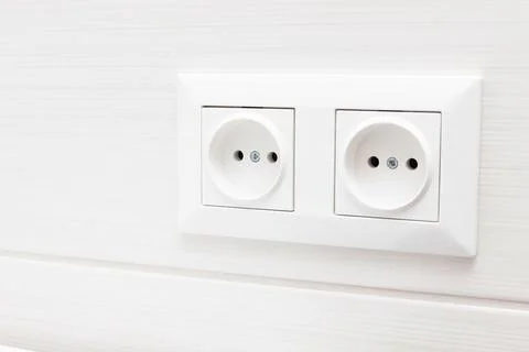 Socket on light tiles in the bathroom. close-up Foto stock