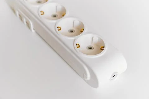 Socket pads for extension cords and surge protectors on a white background. Stock Photos
