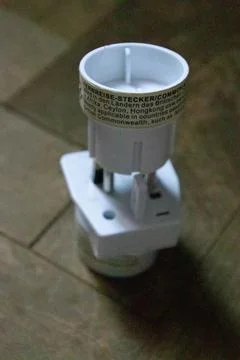 Socket plug adapters isolated on wood background Stock Photos