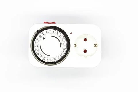 Socket timer. Energy saving concept. Electrical Timer. Electromechanical device Stock Photos