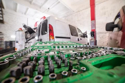 Socket tool kit in busy auto garage Photos
