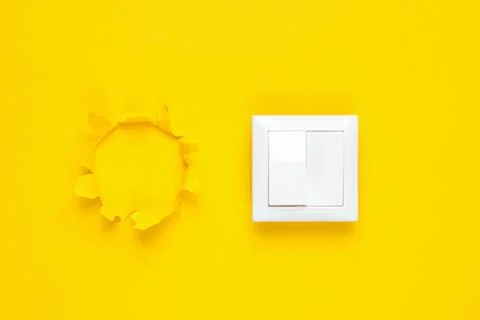 Socket ??? torn hole of yellow background, minimalism 库存照片