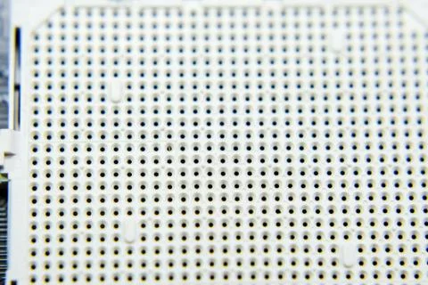 A socket under the processor of the computer, holes under the feet of the con 스톡 사진