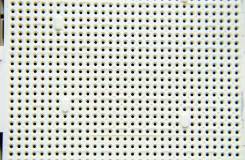 A socket under the processor of the computer, holes under the feet of the con 库存照片