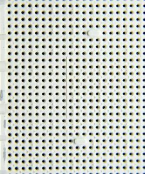 A socket under the processor of the computer, holes under the feet of the con Stock Photos