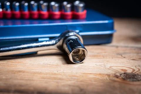 A socket wrench and its inserts on a blue tool box Stock Photos