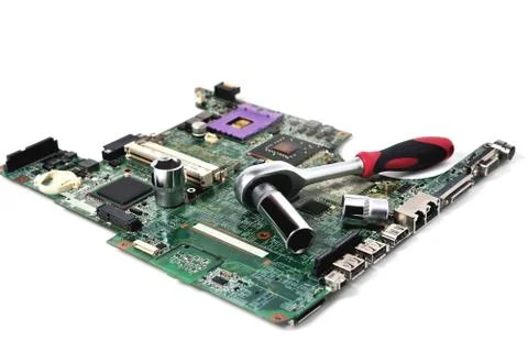 The socket wrench lies on the old chip for the laptop, isolate, large scale,  Foto stock