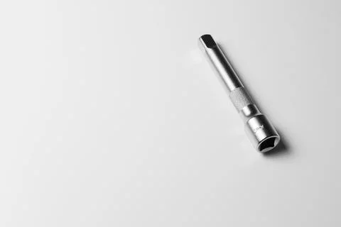 The socket wrench lies on a white table Stock Photos