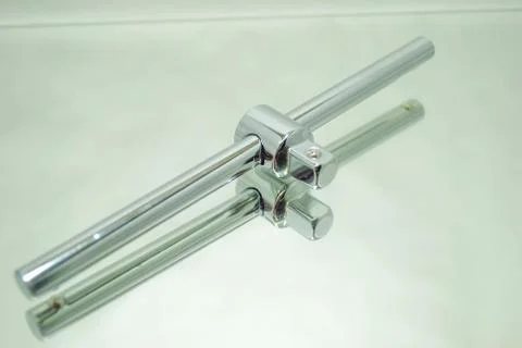 Socket wrench manual handle closeup on mirror Stock Photos