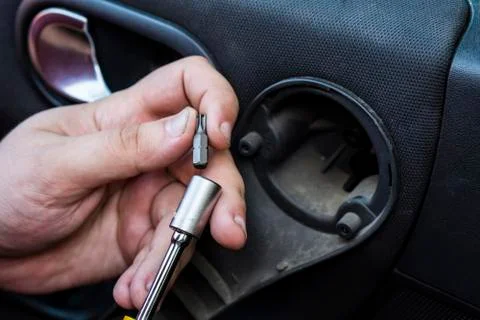 Socket wrench with replaceable bit. Close-up. Car repair. Stock Photos