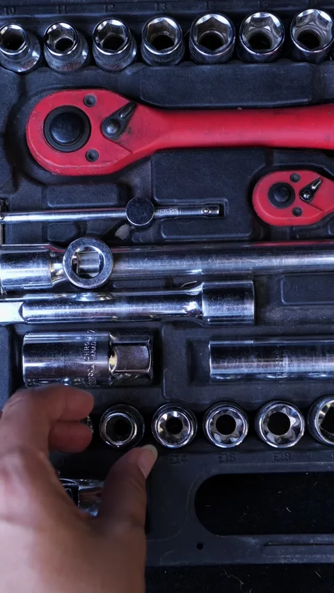 Socket wrench set in a black tool case with a hand picking one piece Vídeo Stock 343568970