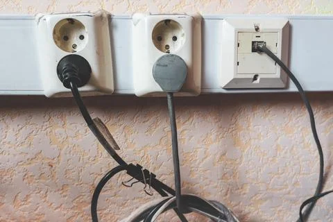Sockets and cables in the office. Stock Photos