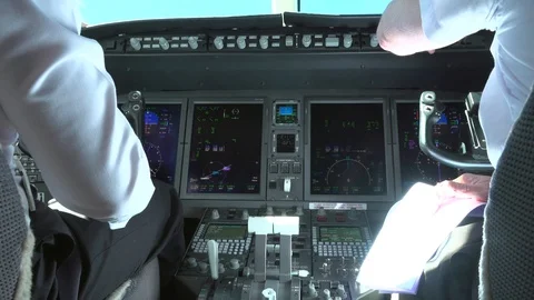 Сockpit view of airline pilot control aircraft in daytime Stock-Footage 105668848