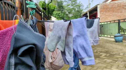 Socks are dried in front of the house Stock Footage 197524488