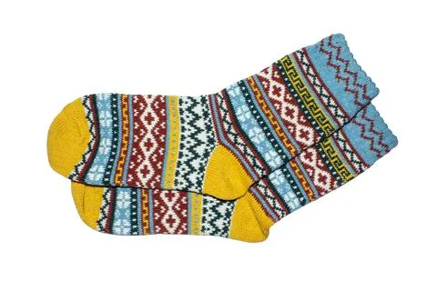 Socks are warm with a pattern on a white background.Wool socks background. Stock Photos