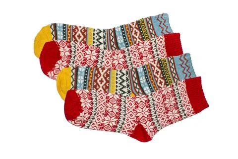Socks are warm with a pattern on a white background.Wool socks background. Stock Photos