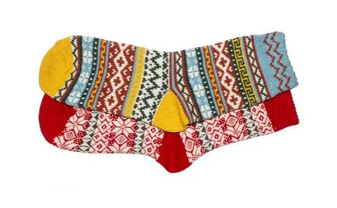Socks are warm with a pattern on a white background.Wool socks background. Stock Photos