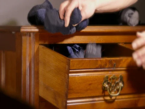 Socks being put into an old chest of drawers. 스톡 동영상 71314515