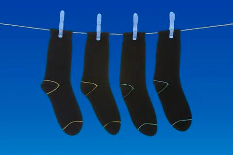 Socks hanging to dry Stock Photos