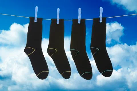 Socks hanging to dry Stock Photos