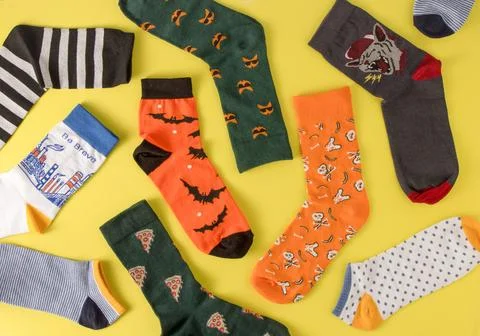 Socks pattern. Bright cheerful sock without a pair top view. A set of different Stock Photos