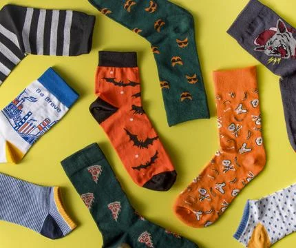 Socks pattern. Bright cheerful sock without a pair top view. A set of different Stock Photos