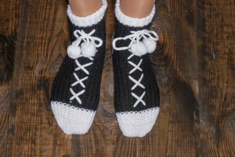 Socks standing on a floor from a tree Foto stock