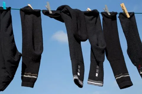 Socks on a washing line Stock Photos