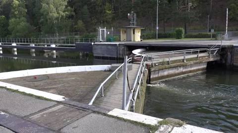 Sodertalje lock upper gates letting the canal water in to lock out ships Stock Footage 67384751