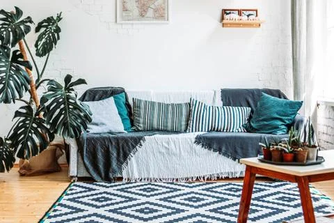 Sofa and table in loft interior Stock Photos