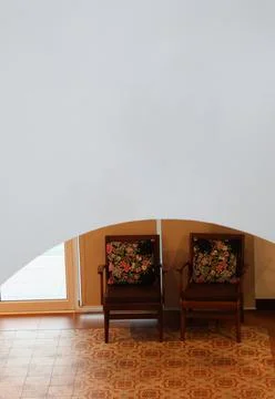 Sofa antique put Infront the exit door and grey wall curve, retro systyle Stock Photos