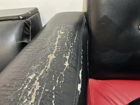 Sofa armrest with peeling and cracked surface 写真素材