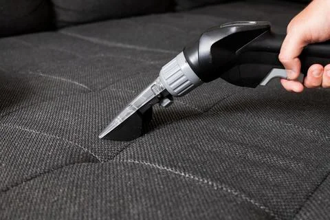 Sofa cleaning close-up Stock Photos