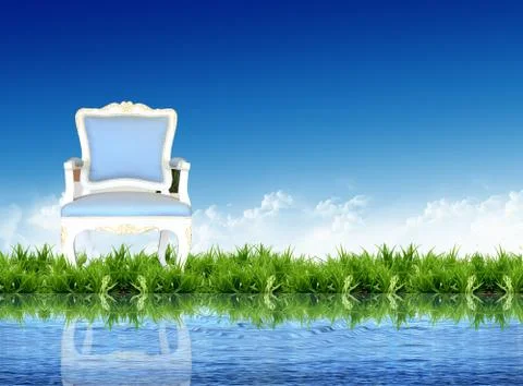 Sofa on the grass with the bright sky Foto stock