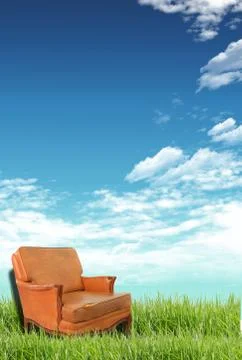 Sofa on the grass field . Stock Photos