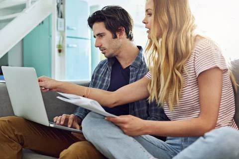 Sofa, laptop and couple with documents for finance review, savings and budg.. Stock Photos