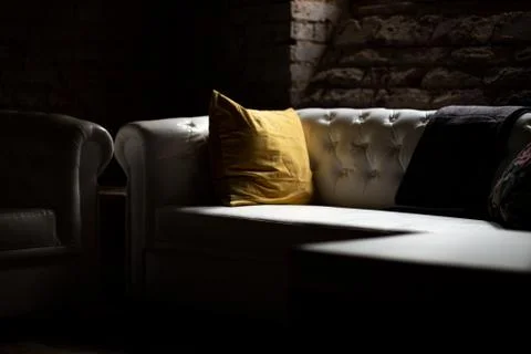 A sofa in a living room Stock Photos
