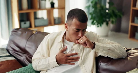 Sofa, man and sick with chest pain for cough, asthma and infection virus in Stock Footage 303619004