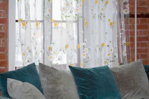 Sofa near the window Stock Photos