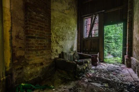 Sofa in an old factory in the forest Stock Photos