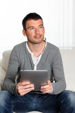 On sofa with tablet Stock Photos