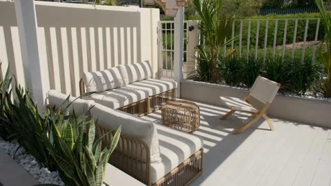 Sofa under a canopy in the backyard of a luxury villa in Dubai on a sunny day Stock Footage 280296697