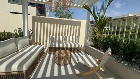 Sofa under a canopy in the backyard of a luxury villa in Dubai on a sunny day Stock Footage 280298136