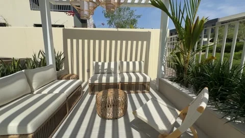 Sofa under a canopy in the backyard of a luxury villa in Dubai on a sunny day Stock Footage 310735007
