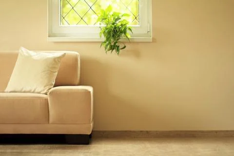 Sofa under window Stock Photos