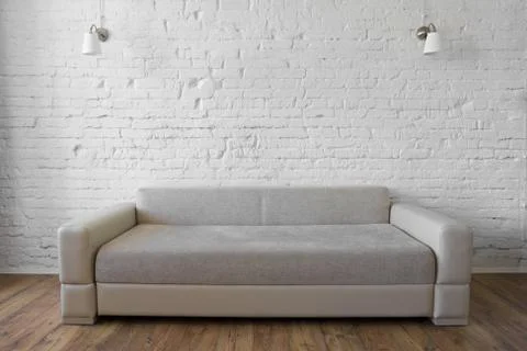 Sofa on white brick wall background textured Stock Photos