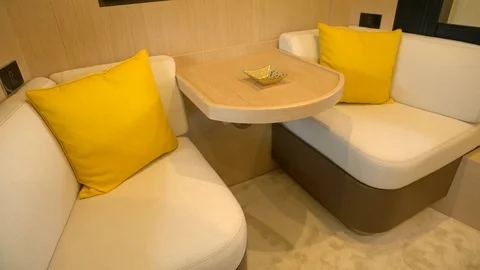 Sofas and coffee table in the main cabin of a yacht. Video stock 82255439